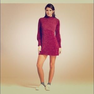 Wine-colored/dark pink form fitting dress.